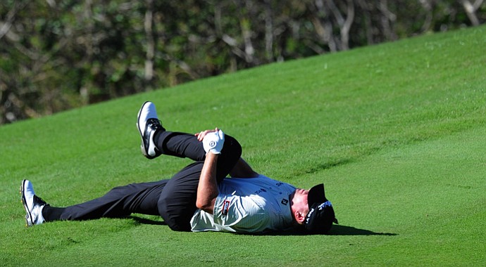 Steve Stricker stretches out his back on the 18th tee box during the second round of the Hyundai Tournament of Champions at Plantation Course.