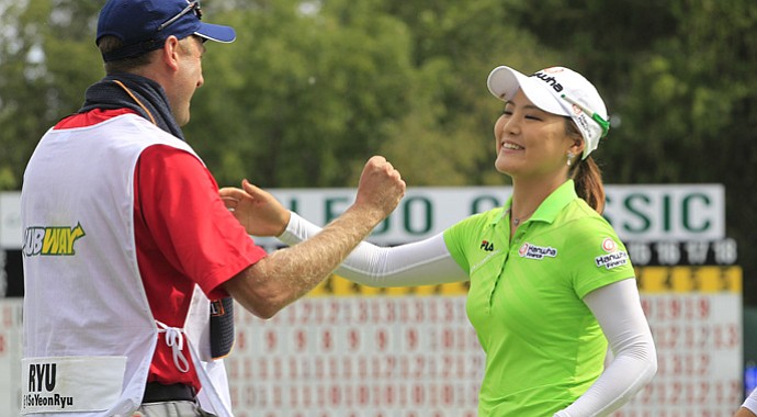 So Yeon Ryu of South Korea hugs her caddie Tom Watson after winning the Jamie Farr Toledo Classic at Highland Meadows Golf Club in Sylvania, Ohio, Sunday, Aug. 12, 2012. Ryu rode a string of six straight birdies in the middle of her round to a 9-under 62 and a seven-stroke victory.
