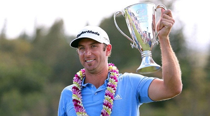 Dustin Johnson celebrates with the Hyundai Tournament of Champions Cup following the final round.