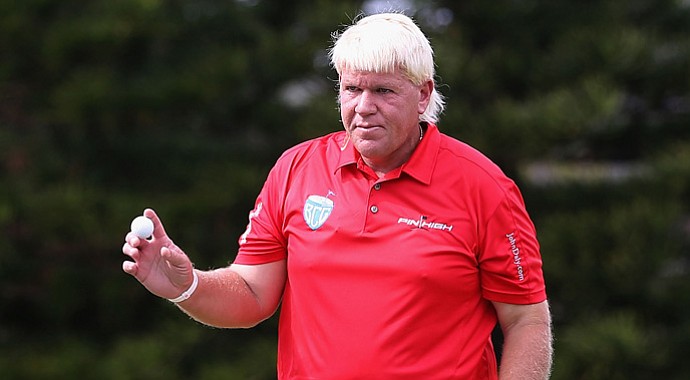John Daly reacts to fans after a par putt on the 15th hole green during the third round of the Sony Open.