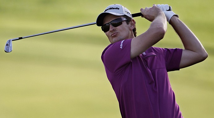 Justin Rose watches a shot during the first round of the Abu Dhabi HSBC Championship.