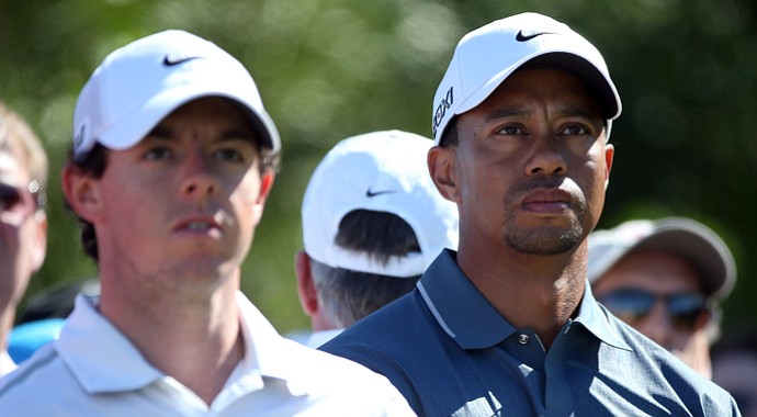 Rory McIlroy (left) and Tiger Woods both struggled with accuracy off the tee and hitting greens in regulation.