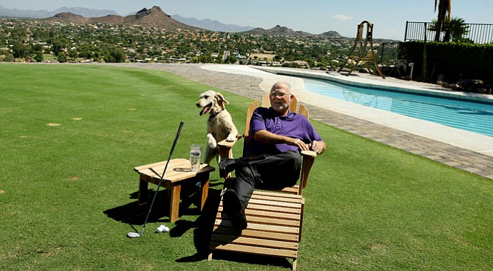 John Solheim with his dog at his home in Phoenix, Ariz.