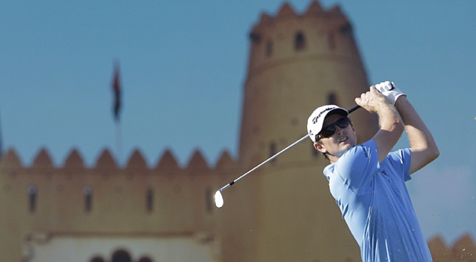 Justin Rose of England follows his ball on the 15th hole during the third round of Abu Dhabi Golf Championship in Abu Dhabi, United Arab Emirates, Saturday, Jan. 19, 2013.