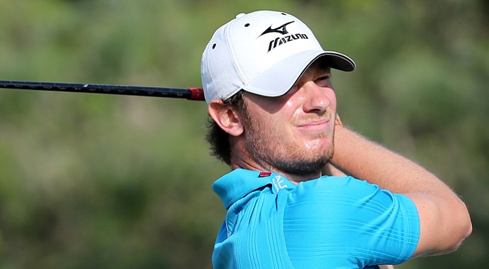 England's Chris Wood plays a shot during the third round of the Qatar Masters.