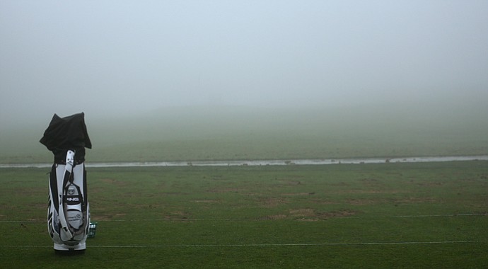 A bag sits on the practice range during a fog delay before the start of the third round of the Farmers Insurance Open on the South Course at Torrey Pines Golf Course on January 26, 2013 in La Jolla, California.