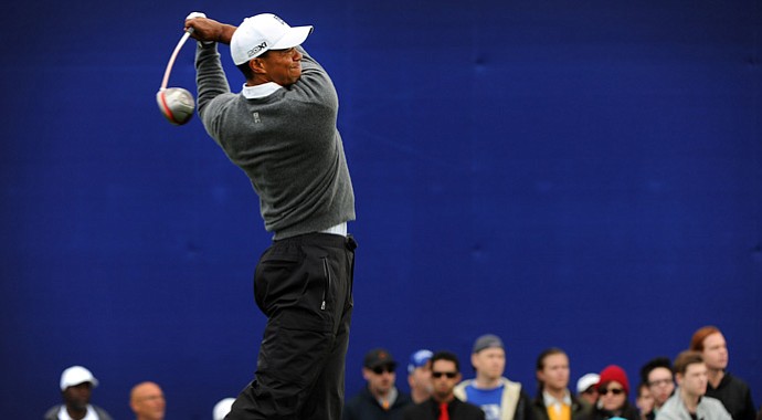Tiger Woods hits a drive on the seventh hole during the third round of the Farmers Insurance Open.