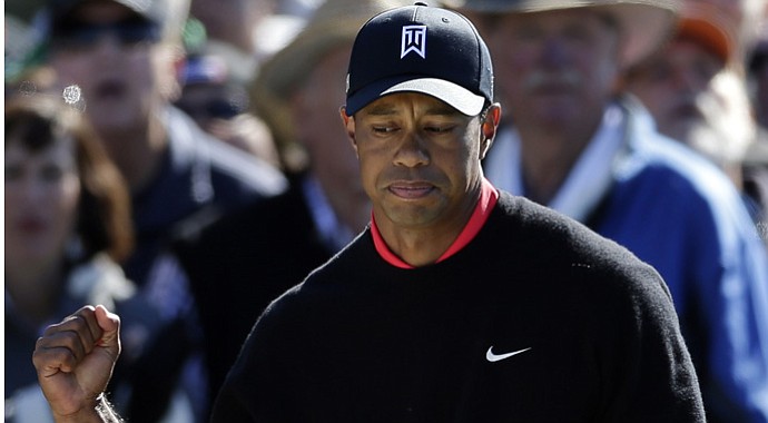 Tiger Woods pumps his fist during the Farmers Insurance Open.