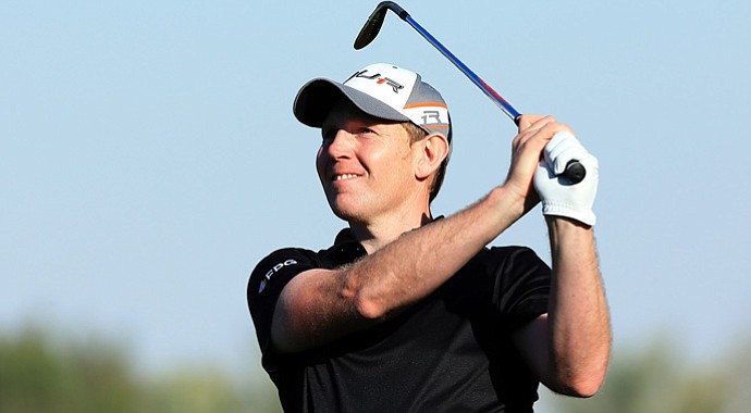 Stephen Gallacher watches his second shot to the 16th green that he holed for an eagle-2 during the final round.