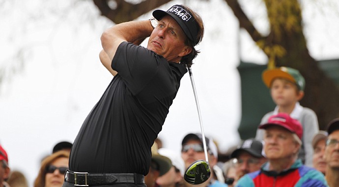 Phil Mickelson hits his tee shot on the third hole during the final round of the Waste Management Phoenix Open.