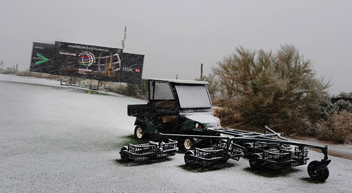 Snow continues to fall on the practice range as snow and rain caused play to be suspended due to weather during the first round of the WGC-Accenture Match Play Championship.