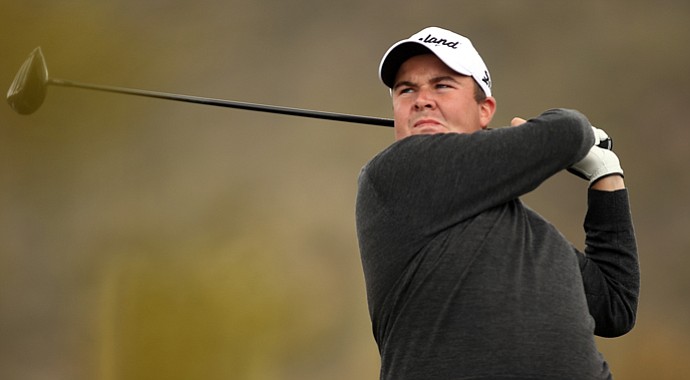 Shane Lowry watches his tee shot on the second hole during the first round of the World Golf Championships-Accenture Match Play at the Golf Club at Dove Mountain on February 21, 2013 in Marana, Ariz.