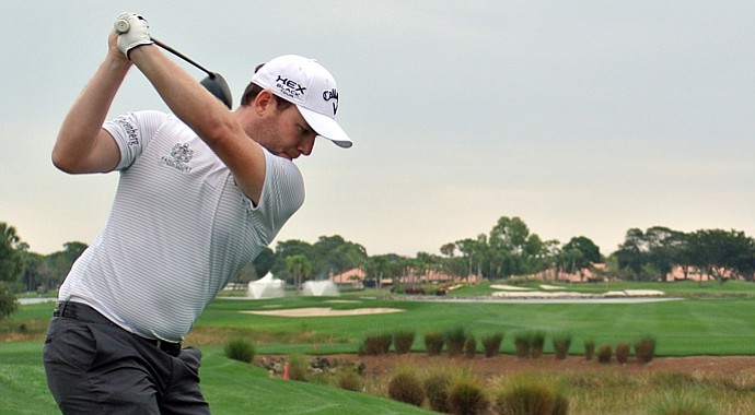 Branden Grace plays his tee shot on the 18th hole during the first round of the Honda Classic.