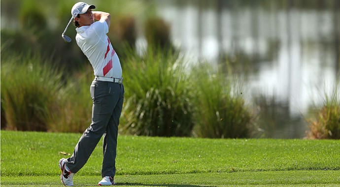 Rory McIlroy hits his approach shot on the eighth hole during the first round of the Honda Classic.