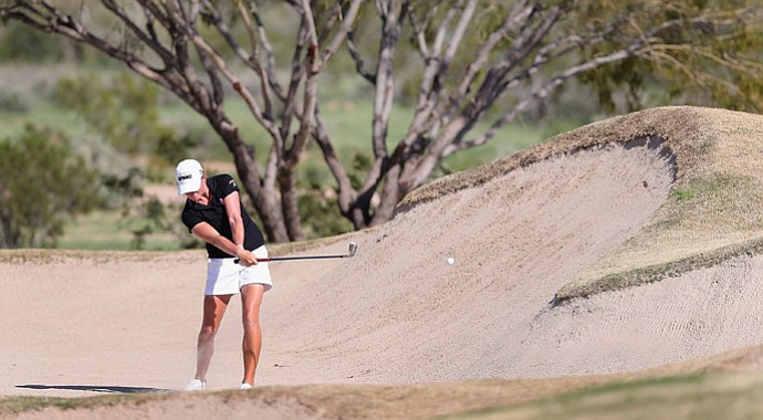 Stacy Lewis hits from the 16th hole bunker during the third round of the RR Donnelley LPGA Founders Cup. Lewis would later receive a two-shot penalty after her caddie, Travis Wilson, tested the bunker prior to this shot. She now trails Ai Miyazato by four shots.