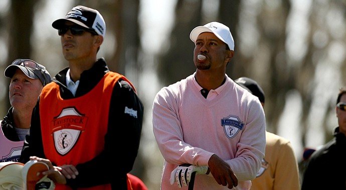 Tiger Woods, representing Team Albany, blows a bubble with his gum while waiting on the tee box at No. 3 in the during the 2013 Tavistock Cup at Isleworth Country Club.