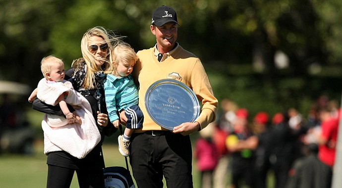 Webb Simpson with his family after he was awarded the Payne Stewart Salver Award during the 2013 Tavistock Cup at Isleworth Country Club.
