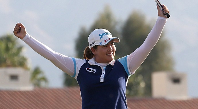 Inbee Park celebrates after making the final putt to win the Kraft Nabisco Championship.