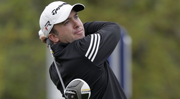 Martin Laird watches his drive on the 1st hole during the final round of the Texas Open.
