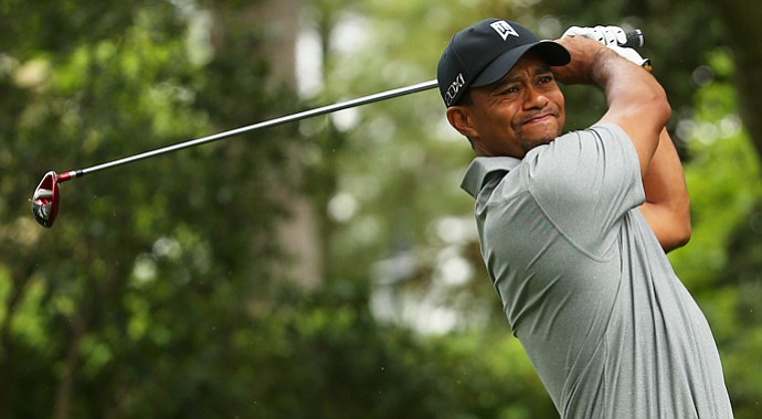 Tiger Woods tees off on the second hole with his 3-wood during the first round of the 2013 Masters.