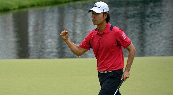 Kevin Na celebrates his eagle on the par-5 15th hole, one of eight on the day at Augusta National.