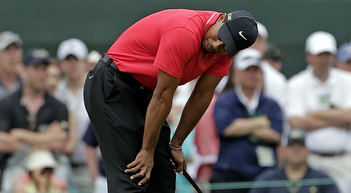Tiger Woods reacts after missing a birdie putt on the first hole during the final round of the Masters Sunday at Augusta National.
