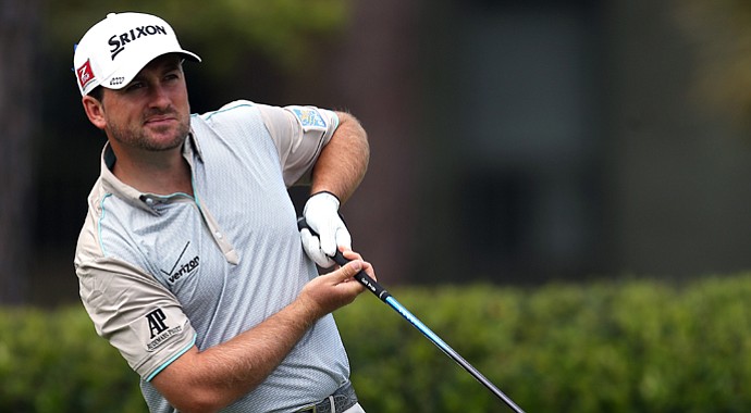 Graeme McDowell reacts to a tee shot on the first hole during the final round of the RBC Heritage.
