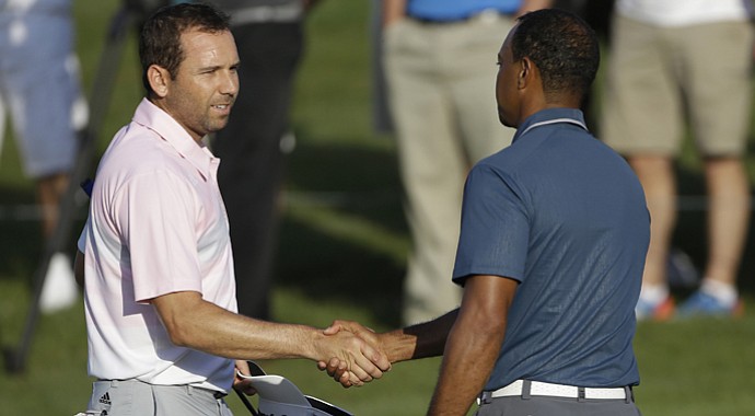 Sergio Garcia, left, shakes hands with Tiger Woods at the conclusion of the third round of the Players Championship.