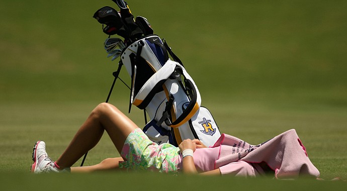 Annie Dulman, playing individually for Rollins, takes a break from the sun at No. 17 at the Division II Women's Final in Daytona Beach.
