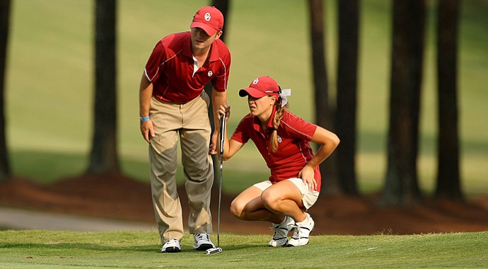 Oklahoma assistant coach Gerrod Chadwell with Anne-Catherine Tanguay in Round 1 of the 2013 Women's NCAA Championship.