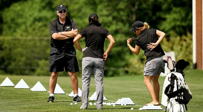 Purdue head coach, Devon Brouse (left) and assistant Caroline Haase (right) work with Paula Reto on the range in the second round of the 2013 Women's NCAA Championship.