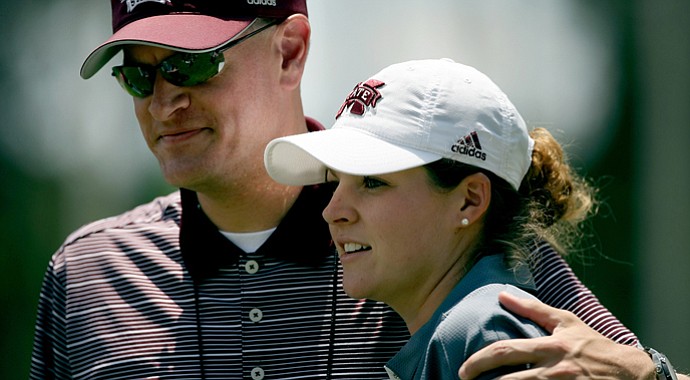 Mississippi State's Ally McDonald gets a hug from athletic director Scott Stricklin during the third round of the 2013 Women's NCAA Championship.