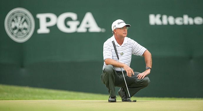 Sonny Skinner, a PGA club professional, reads a putt on the ninth green during the first round of the 74th Senior PGA Championship at Bellerive Country Club on May 23, 2013, in St. Louis.