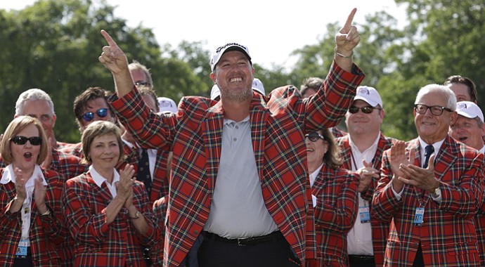 Boo Weekley celebrates after being presented the champion blazer after winning the Crowne Plaza Invitational at Colonial.