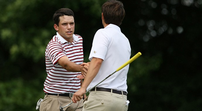 Alabama's Cory Whitsett shakes hands with Georgia Tech's Ollie Schniederjans after Whitsett won 3 and 2 during the semifinals of match play at the 2013 NCAA Championship.