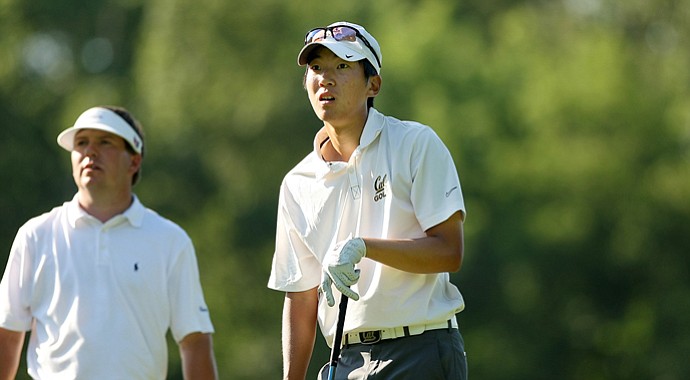 Co-medalist Michael Kim watches his shot at No. 9, his finishing hole, during U. S. Open Sectional Qualifying at Hawks Ridge Golf Club in Ball Ground, Ga.