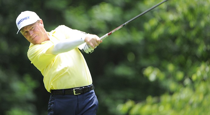 Jeff Sluman tees off on the 9th hole during the first round of the Regions Tradition at Shoal Creek.