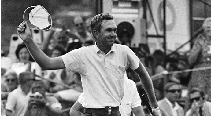 Al Geiberger walks across the 18th green at the Firestone Country Club in Akron, Ohio, July 25, 1966. Geiberger is about to toss his hat after he sank his last putt and won the PGA champion ship by a four-stroke margin.