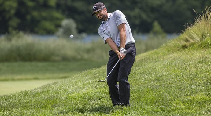 At rain-soaked Merion, where the rough around the greens is long and sticky, the lob wedge appears destined to play a pivotal role. Canadian Adam Hadwin practiced out of the rough on Tuesday afternoon.