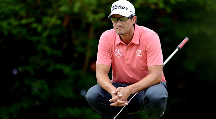 Adam Scott finished the first two rounds at 7 over and isn't inside the current cut line, although that could change on Saturday morning.