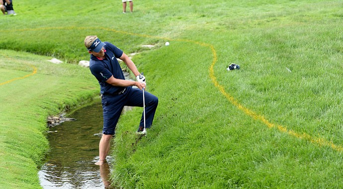 Luke Donald hits his fourth shot on the fourth hole during the final round of the U.S. Open at Merion Golf Club.