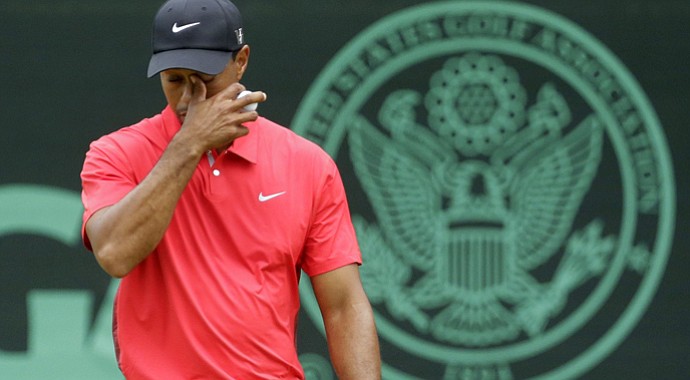 Tiger Woods reacts after putting on the eighth green during the fourth round of the U.S. Open.