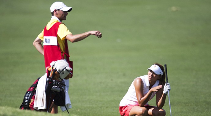 Annie Park gets advice from caddie Justin Silverstein, the assistant coach at USC.