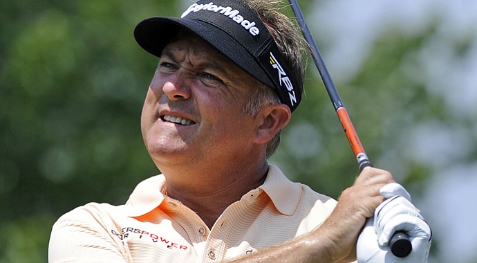 Ken Duke watches his tee shot on the second hole during the final round of the Travelers Championship.