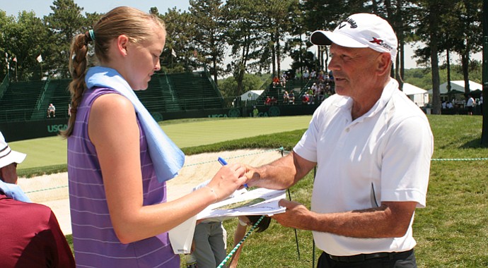 Bruce Stewart, who came to Omaha from rural Oregon, signs an autograph at the U.S. Senior Open.