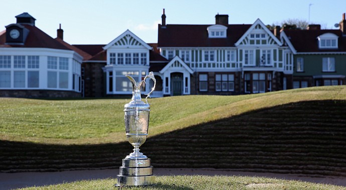 The Claret Jug trophy beside the 18th green in front of the clubhouse prior to The Open Championship at Muirfield.