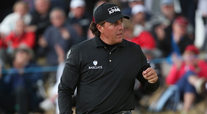 Phil Mickelson celebrates holing a putt on the 14th green during the final round of the Scottish Open at Castle Stuart.