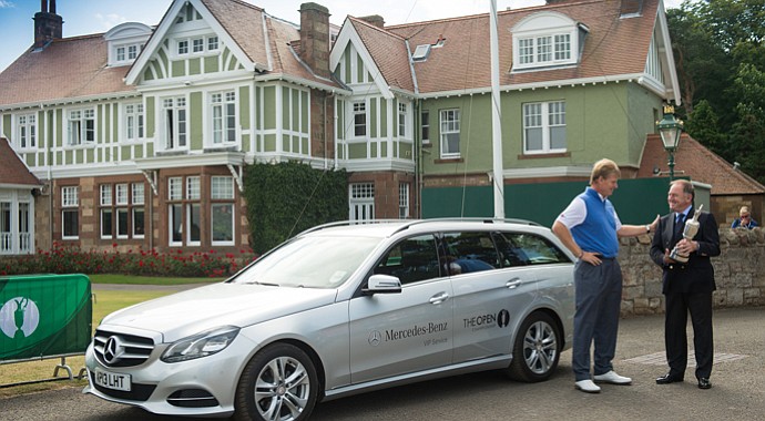 Ernie Els returns the Claret Jug to the R&A's Peter Dawson prior to the official start of the 2013 Open Championship.