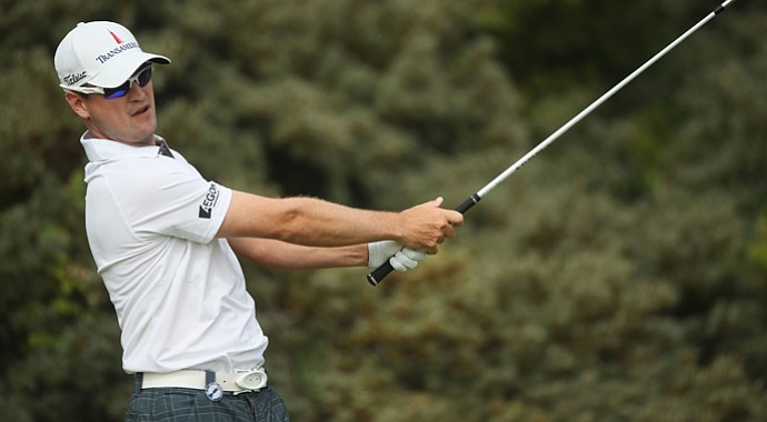 Zach Johnson hits his tee shot on the third hole during the first round of the 142nd Open Championship at Muirfield.