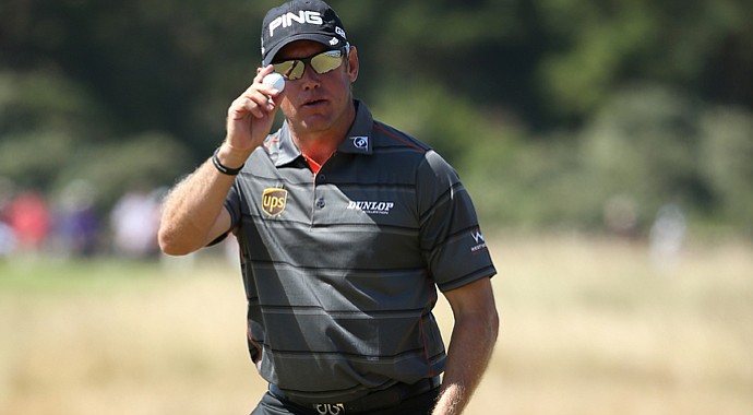 Lee Westwood reacts after making a par putt on the 16th during the second round of the 142nd Open Championship at Muirfield.